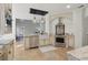 Well-appointed kitchen with a stainless steel range, custom cabinetry, and an island with a sink at 6230 Hampton Highlands Dr, Cumming, GA 30041