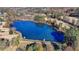 Scenic aerial view of a serene pond surrounded by trees and walking trails, perfect for recreation at 6230 Hampton Highlands Dr, Cumming, GA 30041