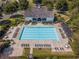 Aerial view of a community pool with lounge chairs and manicured landscaping at 6230 Hampton Highlands Dr, Cumming, GA 30041