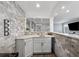 Stylish wet bar area with stone accent wall, white countertops and cabinets, perfect for entertaining at 708 Larkspur Nw Blvd, Acworth, GA 30102