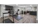Spacious basement featuring a home gym area and a modern kitchen with marble countertops at 708 Larkspur Nw Blvd, Acworth, GA 30102