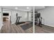 Basement area with home gym equipment and access to an additional living space at 708 Larkspur Nw Blvd, Acworth, GA 30102
