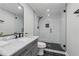 Modern bathroom features a spacious glass shower with white subway tile and a marble countertop vanity at 708 Larkspur Nw Blvd, Acworth, GA 30102