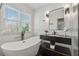 Bathroom featuring a modern tub and an elegant vanity with marble countertops at 708 Larkspur Nw Blvd, Acworth, GA 30102