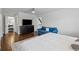 Bright bedroom features hardwood floors, a ceiling fan, and an ensuite bathroom at 708 Larkspur Nw Blvd, Acworth, GA 30102