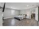 Comfortable bedroom with hardwood floors and a decorative fireplace with a TV above at 708 Larkspur Nw Blvd, Acworth, GA 30102