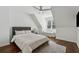 Bright bedroom features hardwood floors, a ceiling fan, and a comfortable white sofa at 708 Larkspur Nw Blvd, Acworth, GA 30102