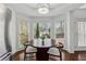 Bright breakfast nook featuring a round wooden table, chairs, and natural light at 708 Larkspur Nw Blvd, Acworth, GA 30102