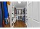 Spacious walk-in closet with custom shelves and ample storage at 708 Larkspur Nw Blvd, Acworth, GA 30102