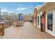 A spacious wooden deck with tables and umbrellas offers an excellent space for outdoor relaxation at 708 Larkspur Nw Blvd, Acworth, GA 30102