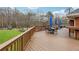 Relax on this spacious wood deck with outdoor seating, umbrellas, and a great lawn view at 708 Larkspur Nw Blvd, Acworth, GA 30102
