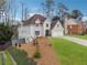 Well-kept home showcasing a landscaped yard, two-car garage, and traditional design elements at 708 Larkspur Nw Blvd, Acworth, GA 30102