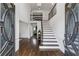 Elegant foyer with hardwood floors, staircase, chandelier, and an open, inviting layout at 708 Larkspur Nw Blvd, Acworth, GA 30102