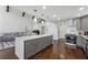Spacious kitchen featuring gray cabinetry, a large island, and an open layout connected to the living area at 708 Larkspur Nw Blvd, Acworth, GA 30102