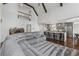 Open-concept living area featuring a gray sofa, kitchen island, and hardwood floors at 708 Larkspur Nw Blvd, Acworth, GA 30102