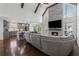 Open-concept living area with stone fireplace, high ceilings, and seamless flow to modern kitchen at 708 Larkspur Nw Blvd, Acworth, GA 30102