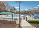 Enjoy a community swimming pool, sundeck, and picnic tables, all secured by a wrought iron fence at 708 Larkspur Nw Blvd, Acworth, GA 30102