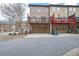 The back exterior shows townhomes with multi-level decks and garage entries at 1952 Appaloosa Mill Cir, Buford, GA 30519
