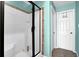 Bathroom featuring glass shower and a white door at 1952 Appaloosa Mill Cir, Buford, GA 30519