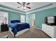 Comfortable bedroom with large windows, tray ceiling, and neutral carpet, creating a tranquil retreat at 1952 Appaloosa Mill Cir, Buford, GA 30519