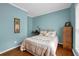 Bedroom featuring a bed with lots of pillows and decor throughout at 1952 Appaloosa Mill Cir, Buford, GA 30519
