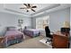 Bedroom with neutral carpet and two twin beds, as well as a desk area by the window at 1952 Appaloosa Mill Cir, Buford, GA 30519