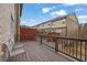 A wooden deck offers outdoor seating with views of the neighborhood townhomes at 1952 Appaloosa Mill Cir, Buford, GA 30519