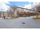 Exterior view of townhomes with garages, multiple decks, and street parking at 1952 Appaloosa Mill Cir, Buford, GA 30519