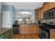 Spacious kitchen with stainless steel appliances, granite countertops, and an open view to the living area at 1952 Appaloosa Mill Cir, Buford, GA 30519