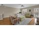 Spacious living room with hardwood floors and natural light from large windows at 1952 Appaloosa Mill Cir, Buford, GA 30519