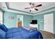 Calm main bedroom with natural light, a tray ceiling, and access to ensuite bathroom at 1952 Appaloosa Mill Cir, Buford, GA 30519