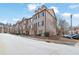 Beautiful townhome community with tree-lined streets and well-kept exteriors at 1952 Appaloosa Mill Cir, Buford, GA 30519