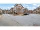 Exterior view of residential street with townhomes and parked cars at 1952 Appaloosa Mill Cir, Buford, GA 30519