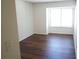This is a bedroom with a window that allows natural light to illuminate the floor and walls at 2211 Surrey Se Ct, Marietta, GA 30067