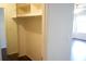 This is a closet with wooden floors and white shelves for organizing clothes and storage at 2211 Surrey Se Ct, Marietta, GA 30067