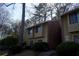 Inviting exterior view of townhomes with well-maintained landscaping and classic brick accents at 2211 Surrey Se Ct, Marietta, GA 30067