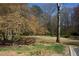 Beautiful greenspace featuring mature trees and grassy areas, providing a natural and inviting environment at 2211 Surrey Se Ct, Marietta, GA 30067