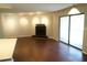 Comfortable living room boasts sleek fireplace and large sliding glass doors to private balcony at 2211 Surrey Se Ct, Marietta, GA 30067