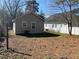 View of the backyard from the side of the house showing the side yard and fence at 2938 Palm Dr, Atlanta, GA 30344