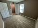 Cozy bedroom featuring neutral carpet and a closet at 2938 Palm Dr, Atlanta, GA 30344