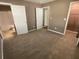 A carpeted bedroom with access to a bathroom and walk-in closet, offering convenience and comfort at 2938 Palm Dr, Atlanta, GA 30344