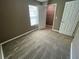 A well-lit bedroom featuring neutral tones and carpet, complemented by a large window at 2938 Palm Dr, Atlanta, GA 30344