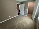 Comfortable carpeted bedroom with a closet at 2938 Palm Dr, Atlanta, GA 30344