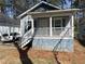 Charming single-Gathering home with a covered front porch and inviting curb appeal at 2938 Palm Dr, Atlanta, GA 30344