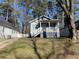 Charming home with a covered front porch and well-maintained lawn at 2938 Palm Dr, Atlanta, GA 30344