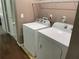 Washer and dryer in laundry area with wire shelving for easy storage at 2938 Palm Dr, Atlanta, GA 30344