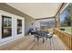 Cozy covered back porch with comfortable seating, offering a peaceful outdoor relaxation spot at 3878 Amicus Dr, Buford, GA 30519