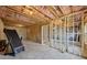 Spacious unfinished basement with ample potential, showcasing open layout and essential infrastructure at 3878 Amicus Dr, Buford, GA 30519