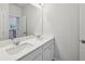 Bathroom featuring a double vanity with an open view to the upstairs hallway at 3878 Amicus Dr, Buford, GA 30519