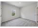 Comfortable bedroom with neutral color scheme, plush carpet and bright light from a window at 3878 Amicus Dr, Buford, GA 30519